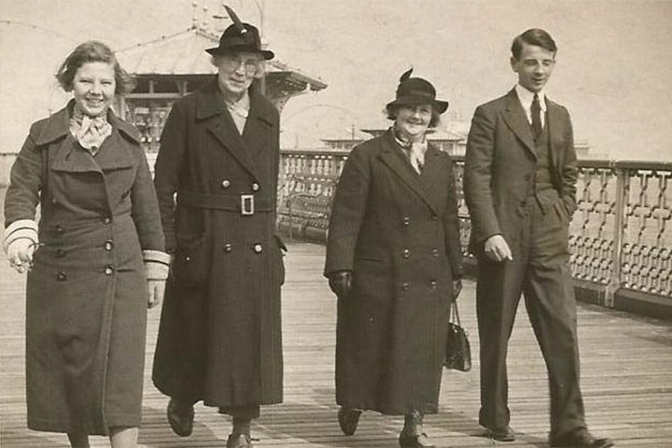 Edith Rigby, second from the left, walking on a Pier