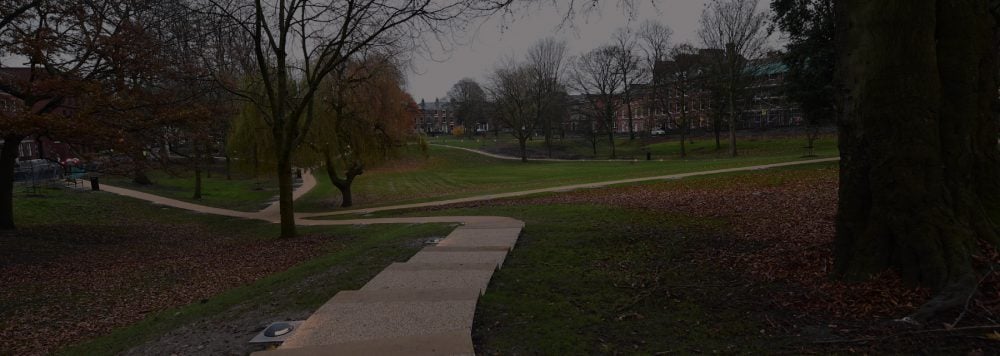Stone pathway in Winckley Square with buildings in background